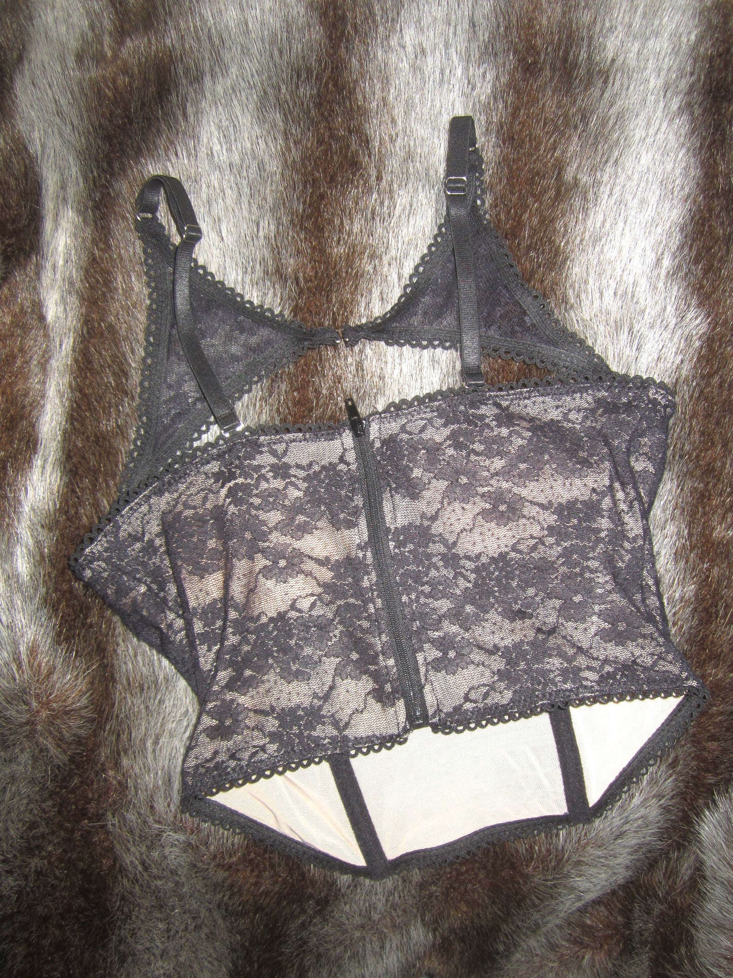 Versatile black top featuring a removable halter corset