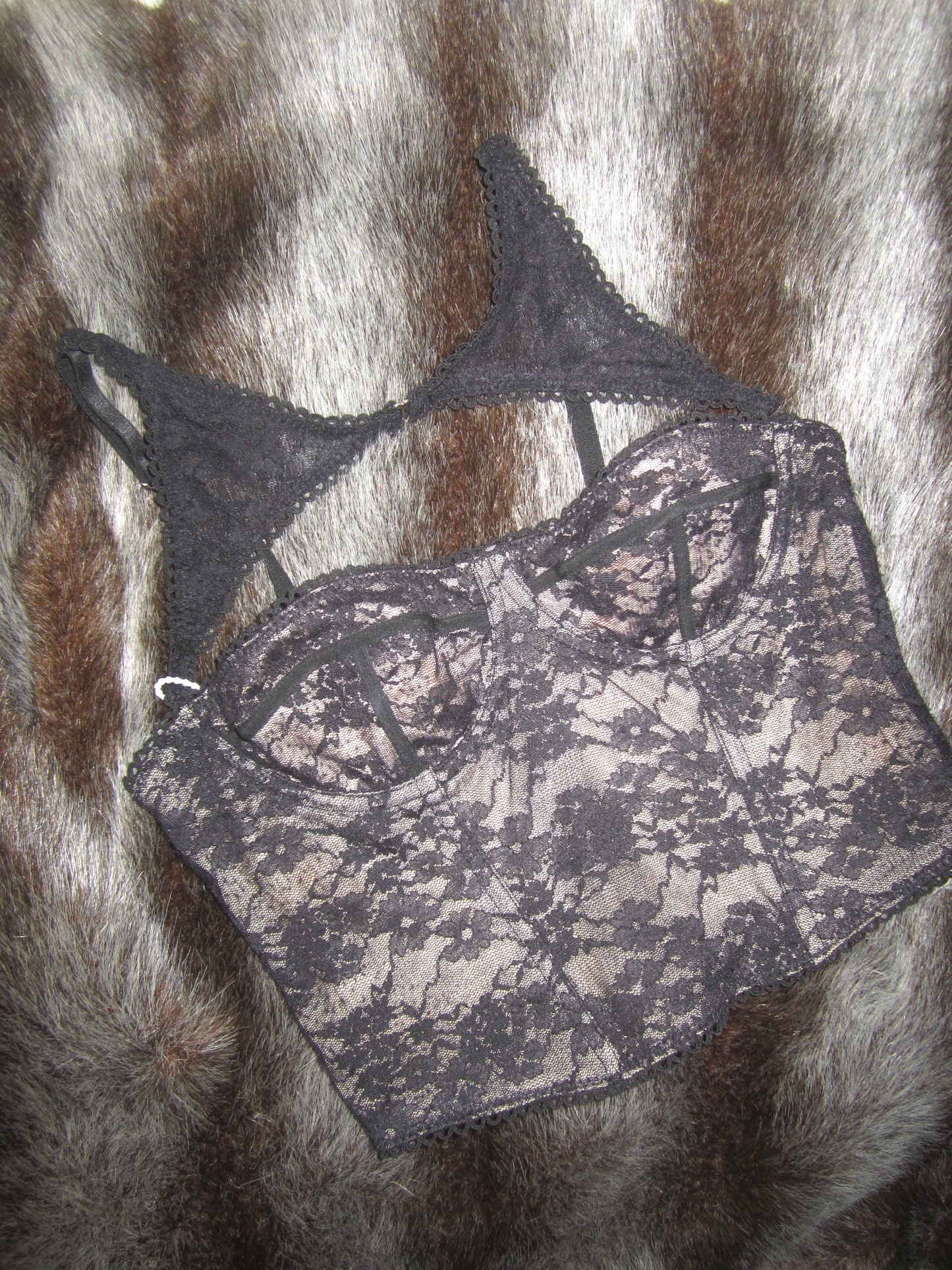 Versatile black top featuring a removable halter corset